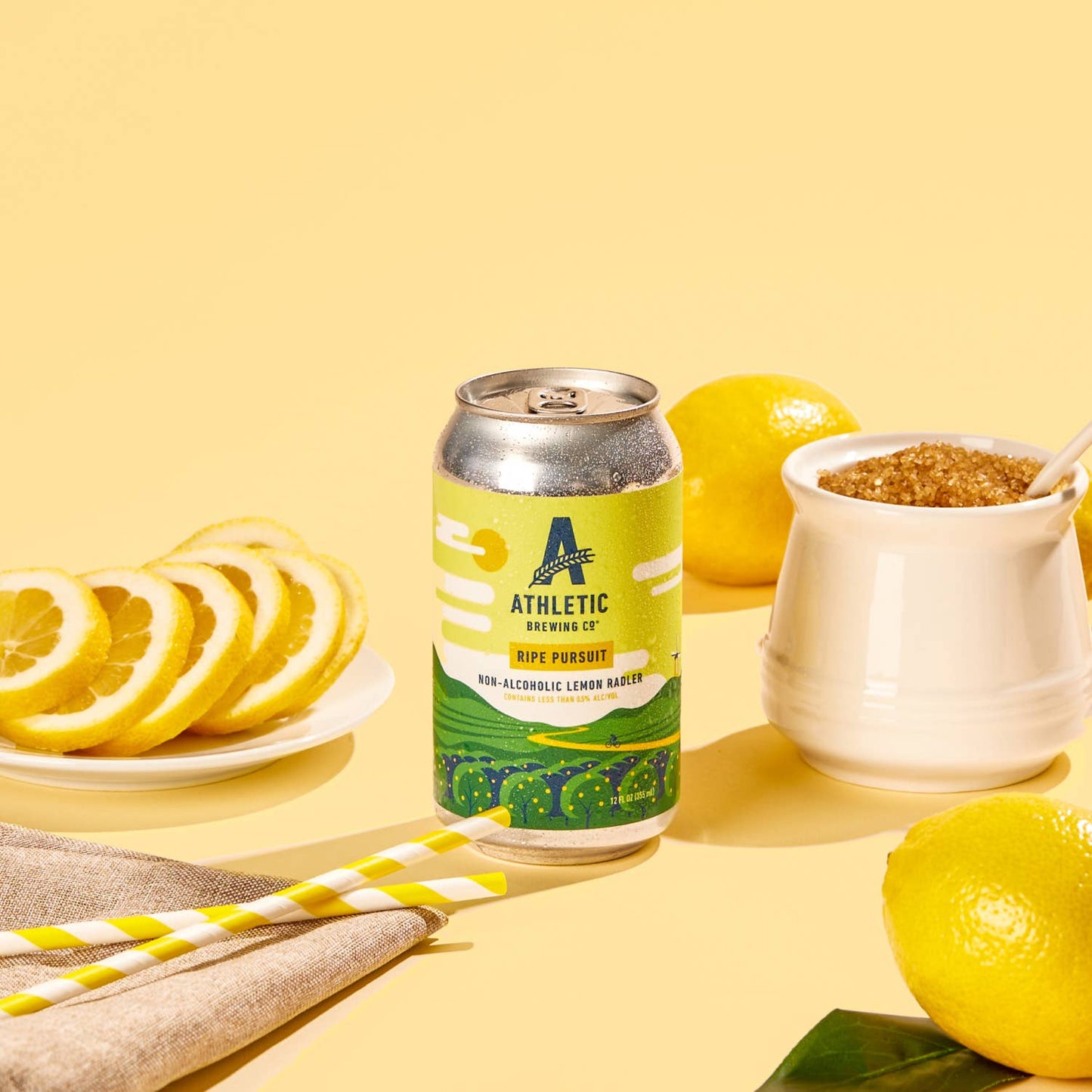 a can of athletic non-alcoholic ripe pursuit with lemons, sugar and staraws